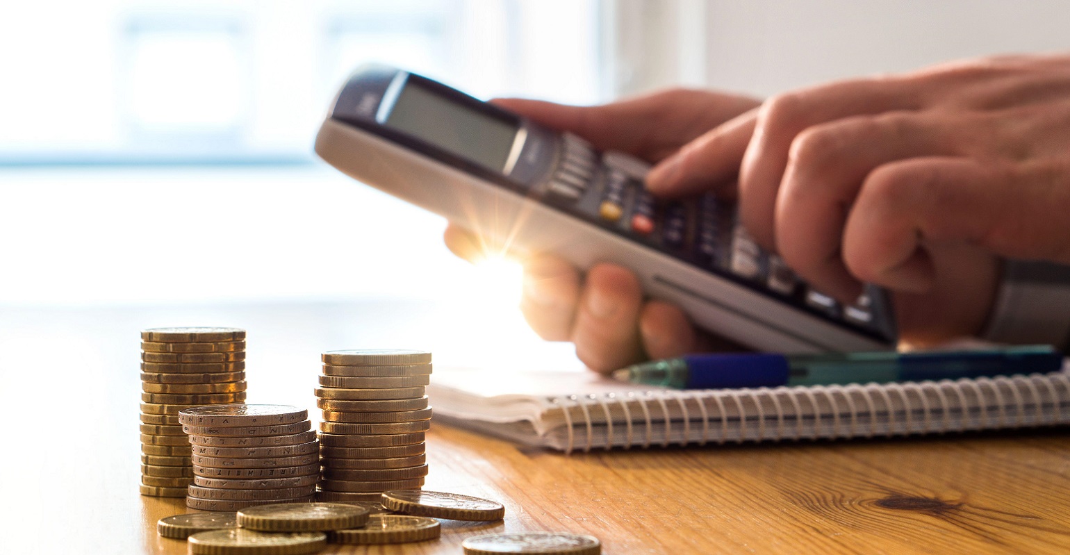 man using a calculator