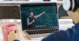 student learning with teacher on black board via video call conference student learning with teacher on black board via video call conference