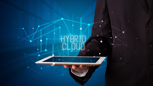 "hybrid cloud" written above a tablet "hybrid cloud" written above a tablet