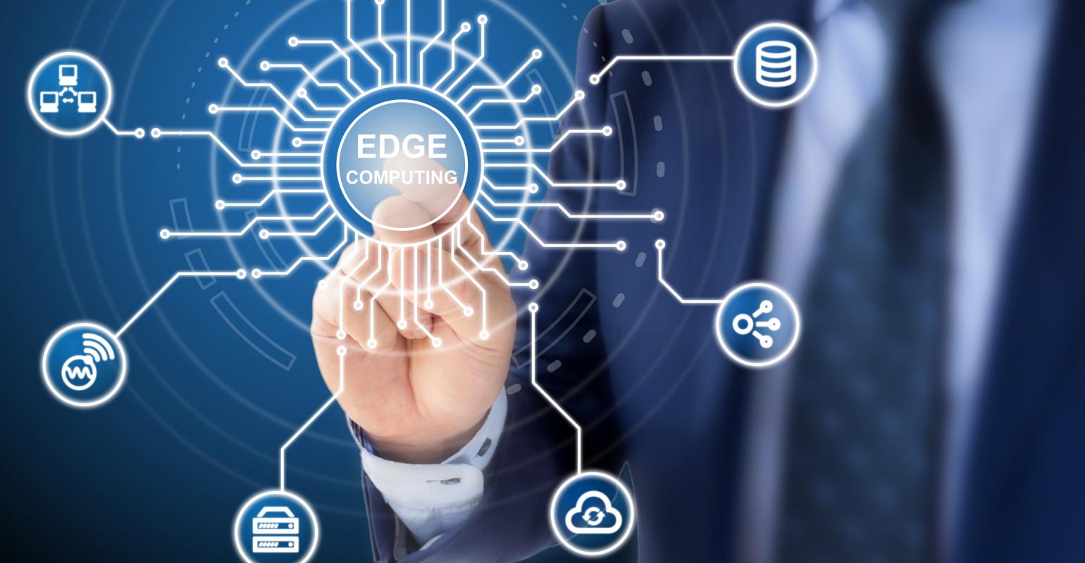 man pressing an edge computing button