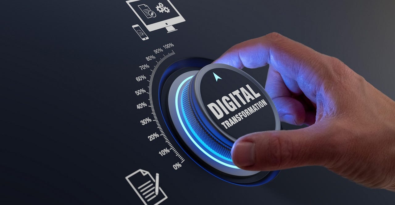 hand turning a knob with the words "digital transformation" on it hand turning a knob with the words "digital transformation" on it