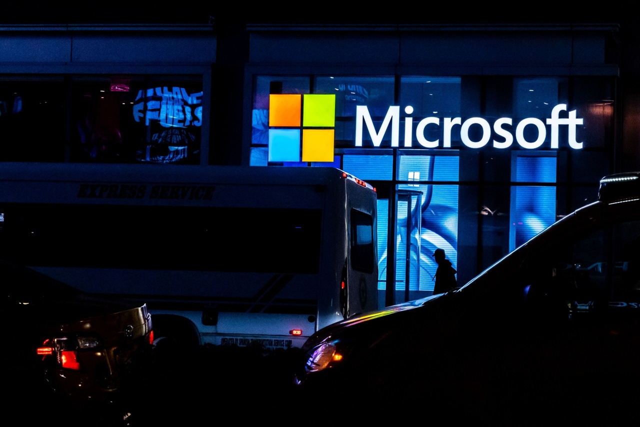 Microsoft logo on building at night Microsoft logo on building at night