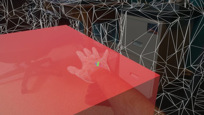 view from HoloLens 2 device of user's hand touching a large red cube view from HoloLens 2 device of user's hand touching a large red cube