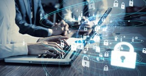 business person typing on a laptop amid a swarm of padlock icons business person typing on a laptop amid a swarm of padlock icons