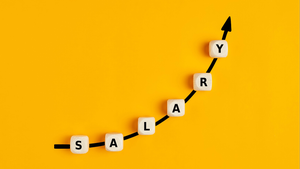 salary increase concept wtih the word "salary" written on wooden blocks with an ascending arrow graph salary increase concept wtih the word "salary" written on wooden blocks with an ascending arrow graph