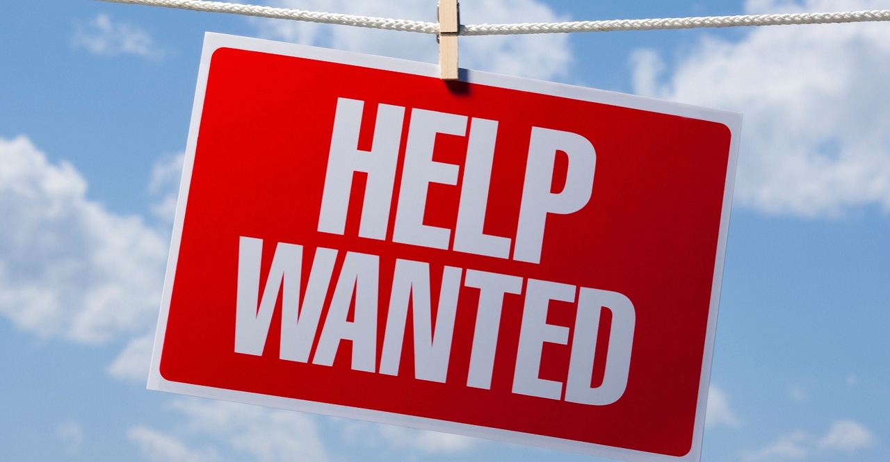 help wanted sign hanging from a clothes line help wanted sign hanging from a clothes line