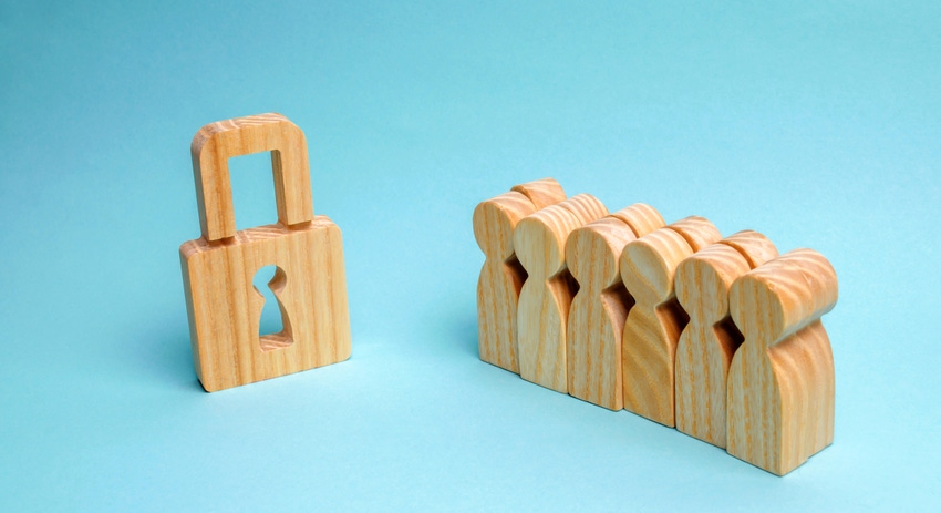 wood blocks shaped like a lock and a group of people