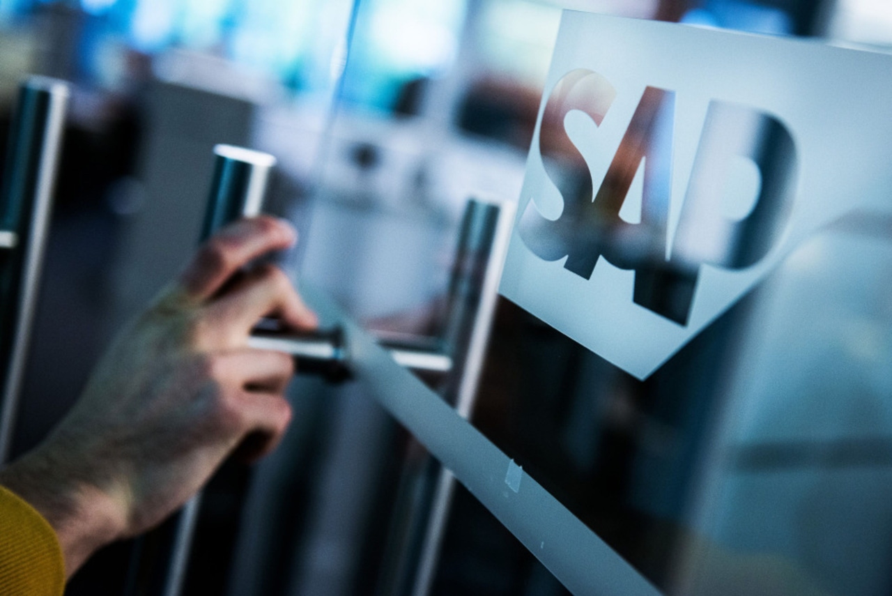 person opening an office door with the SAP logo on it person opening an office door with the SAP logo on it