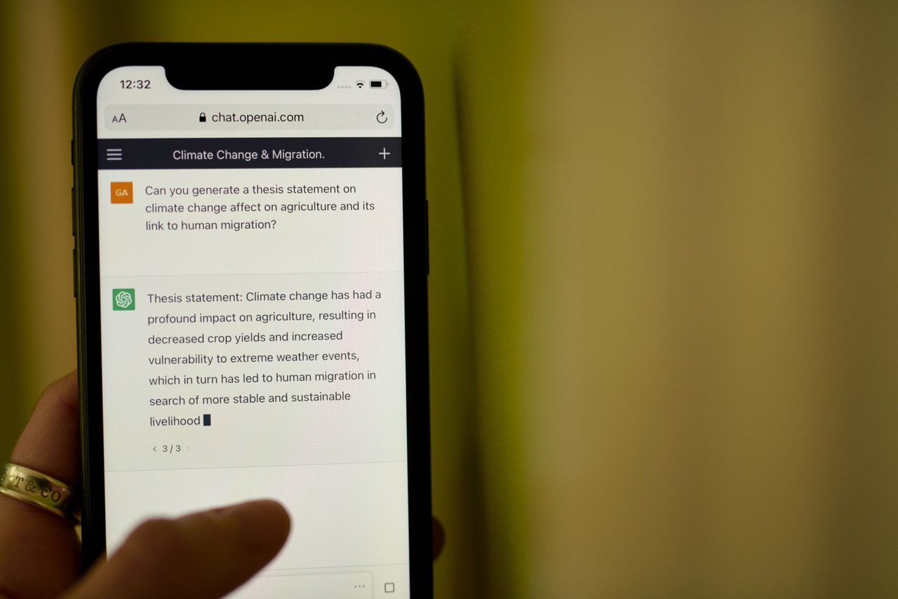 a person on a smartphone interacts with ChatGPT a person on a smartphone interacts with ChatGPT