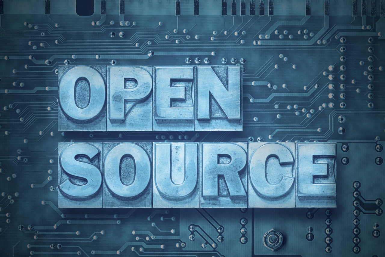 open source phrase made from metallic letterpress blocks on the pc board background open source phrase made from metallic letterpress blocks on the pc board background