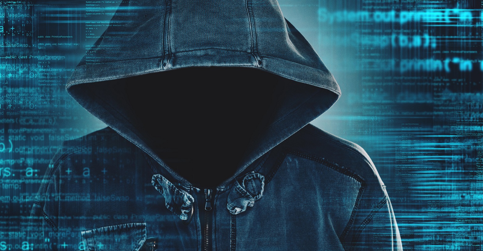 hacker wearing a hood