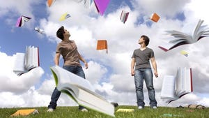 Two young men on grass with SQL Server books flying in the air Two young men on grass with SQL Server books flying in the air