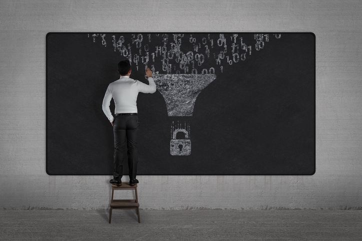 man writing on chalkboard