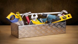 silver toolbox with multicolored tools organized inside