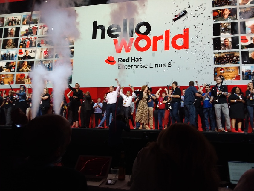 Stage full of people celebrating launch of RHEL 8 at Red Hat Summit 2019