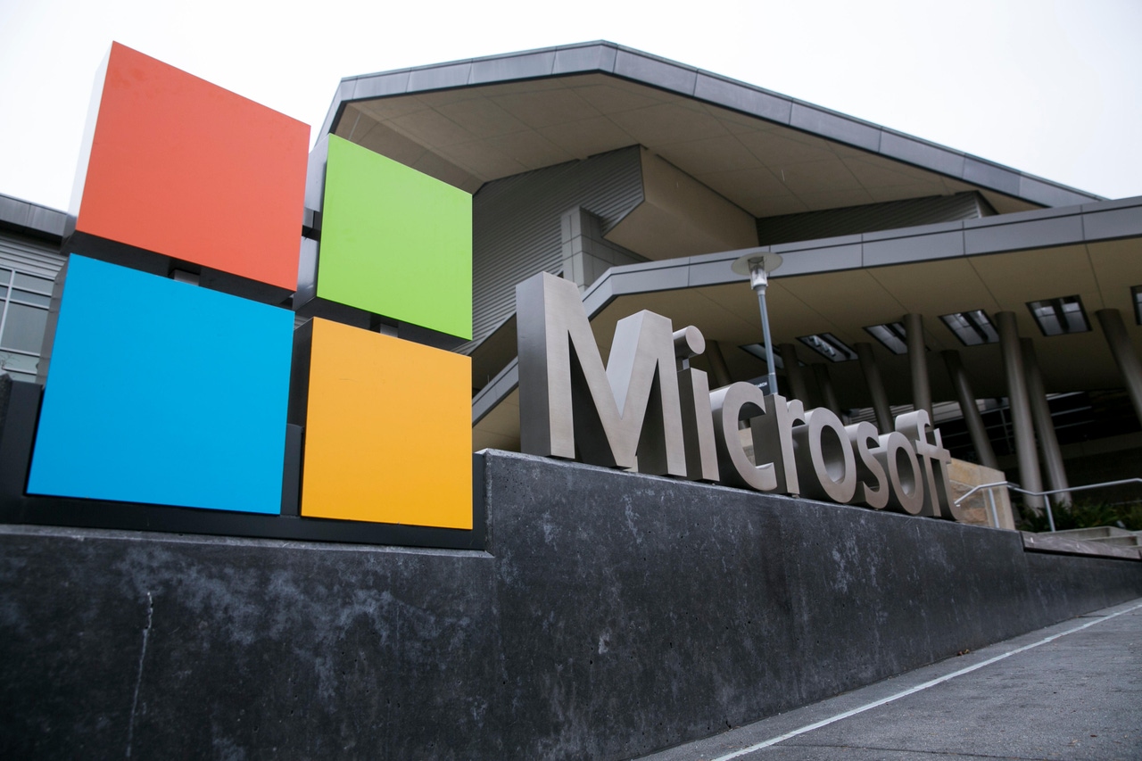 Microsoft logo on sign in front of building Microsoft logo on sign in front of building