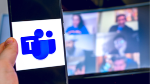 hand use videoconference app icon of Microsoft Teams on smartphone