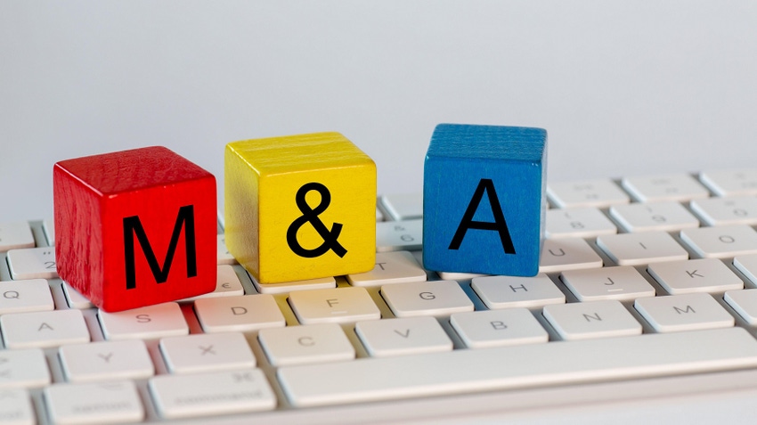colorful blocks spelling "M&A" on top of a keyboard