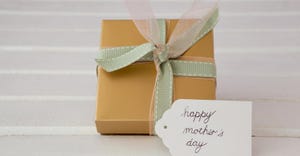 wrapped gift with Mother's Day card