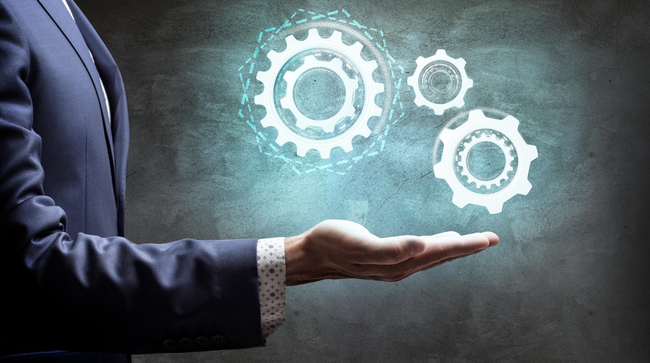 a business man and digital gears a business man and digital gears