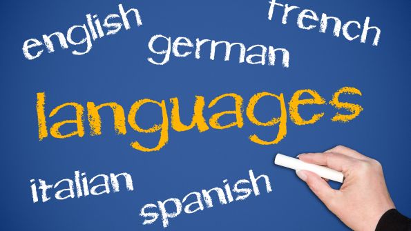 blue chalkboard different languages written in white and LANGUAGES in yellow blue chalkboard different languages written in white and LANGUAGES in yellow