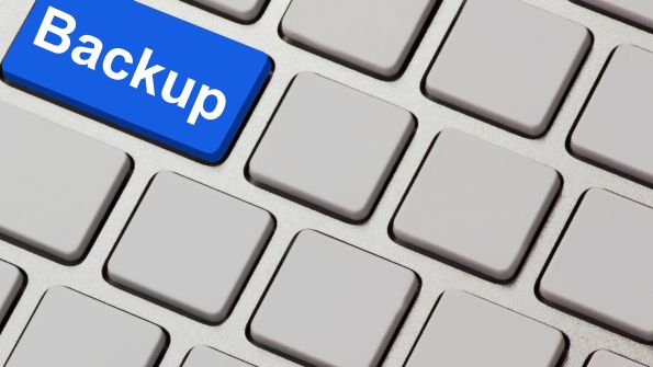 blue backup key on grey computer keyboard blue backup key on grey computer keyboard