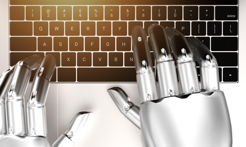 robot typing on a laptop keyboard