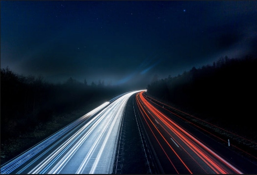 Light trails on highway at night.