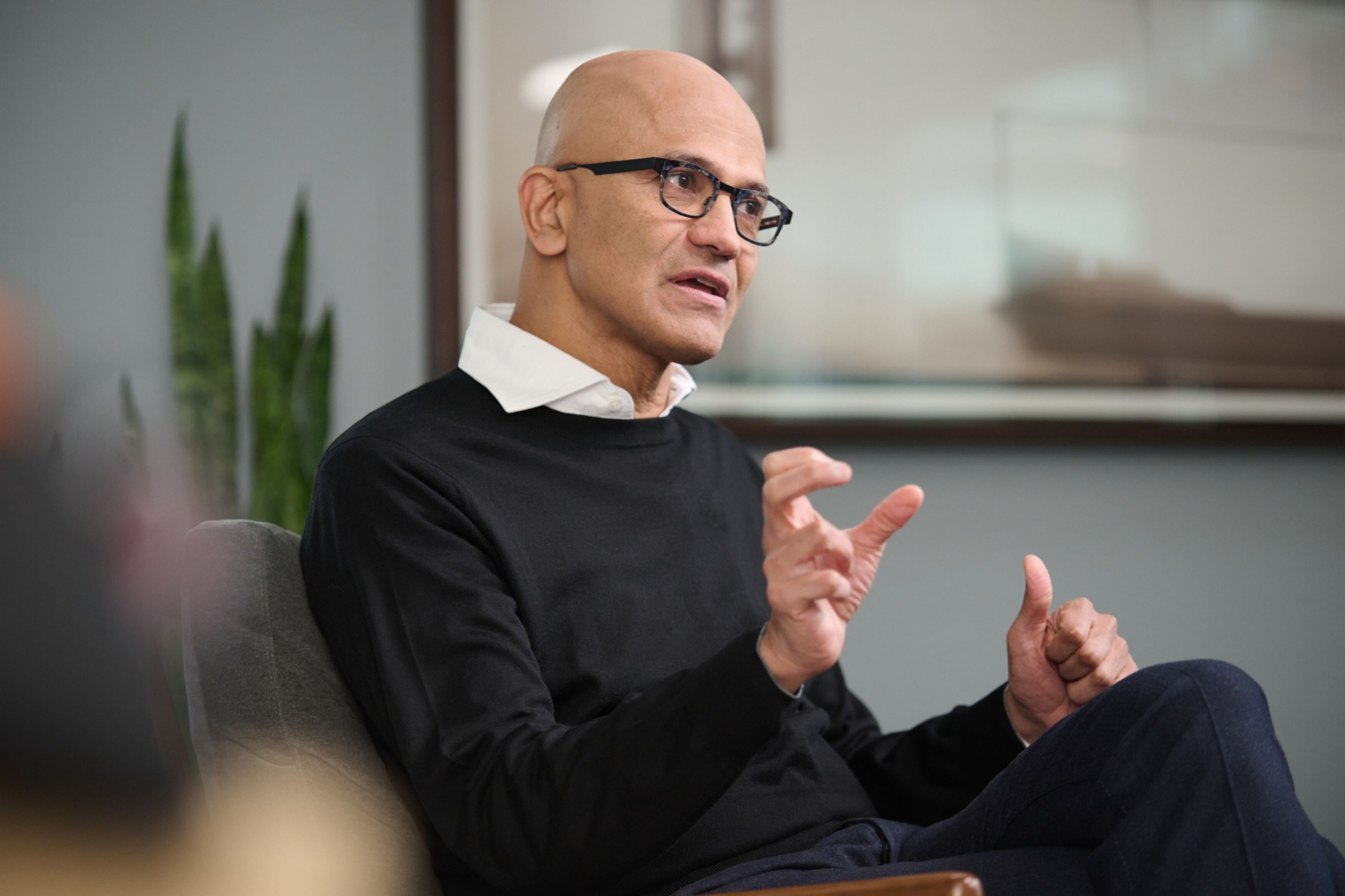 Nadella, Microsoft CEO, sitting