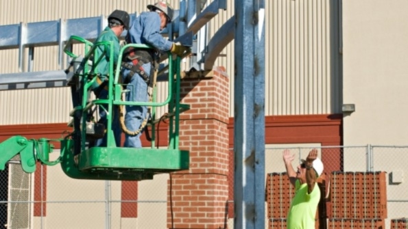 Construction workers on a construction site Construction workers on a construction site