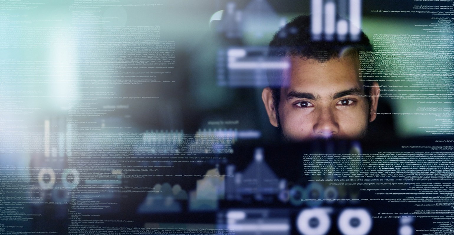 computer programmer looking through data