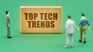 3 people looking at a Top Tech Trends board 3 people looking at a Top Tech Trends board