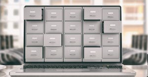 stacked storage boxes on a computer stacked storage boxes on a computer