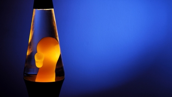 Lava lamp with yellow blob on blue background Lava lamp with yellow blob on blue background