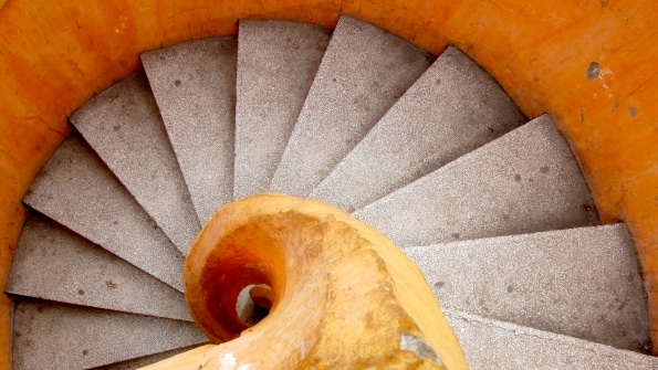 tan and grey spiral stairs looks similar to a shell