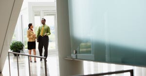Businesspeople entering office building Businesspeople entering office building