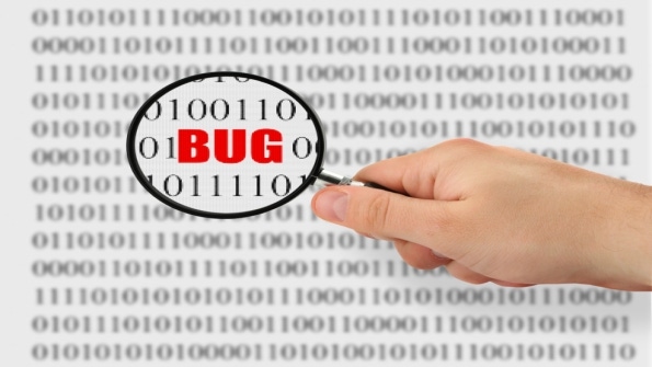 binary code with BUG in red magnified by hand holding magnifying glass binary code with BUG in red magnified by hand holding magnifying glass
