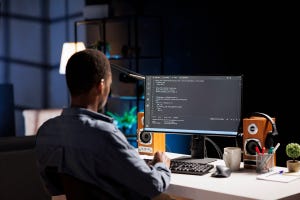 software developer working at his computer