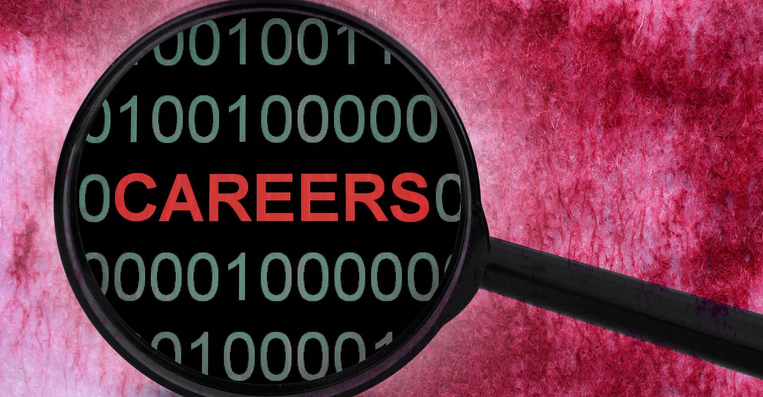 careers and code being seen through a magnifying glass