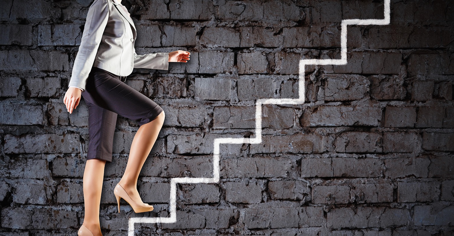 professional woman walking up stairs