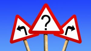 three road signs one with question mark other two with opposite facing arrows