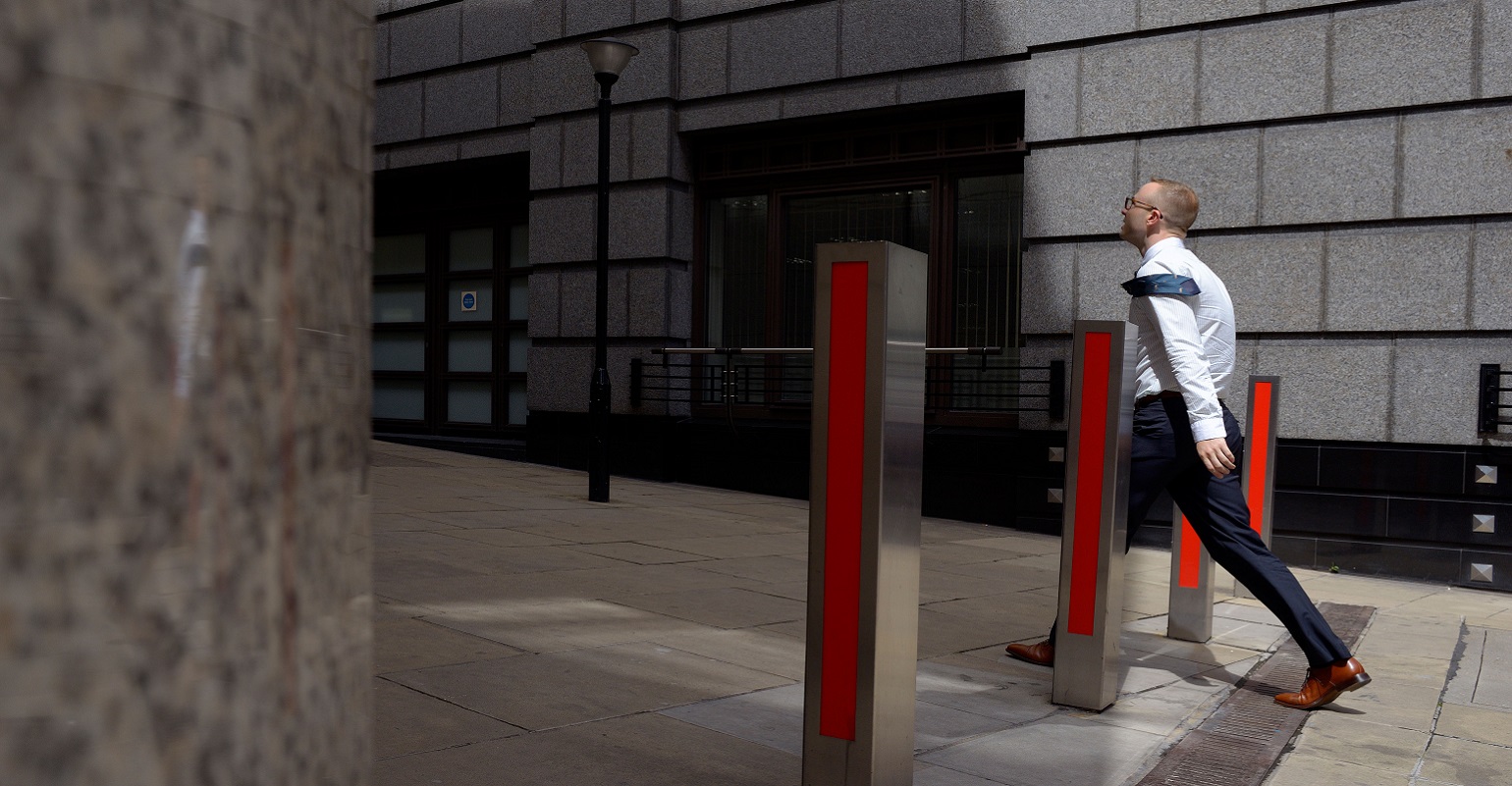 man walking into the wind on the way to the office