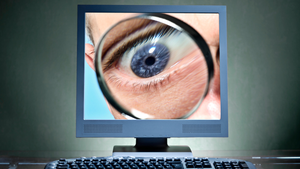 eye with magnifier on a computer screen