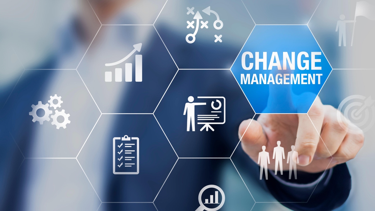 businessman pushing a change management button businessman pushing a change management button