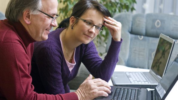 Man and woman working on laptops Man and woman working on laptops