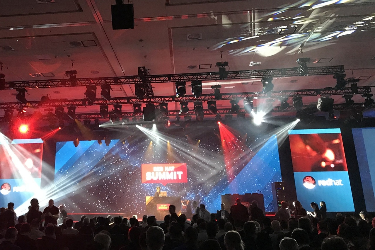 A stage lit up for Red Hat conference A stage lit up for Red Hat conference