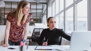 two women working together at a laptop two women working together at a laptop