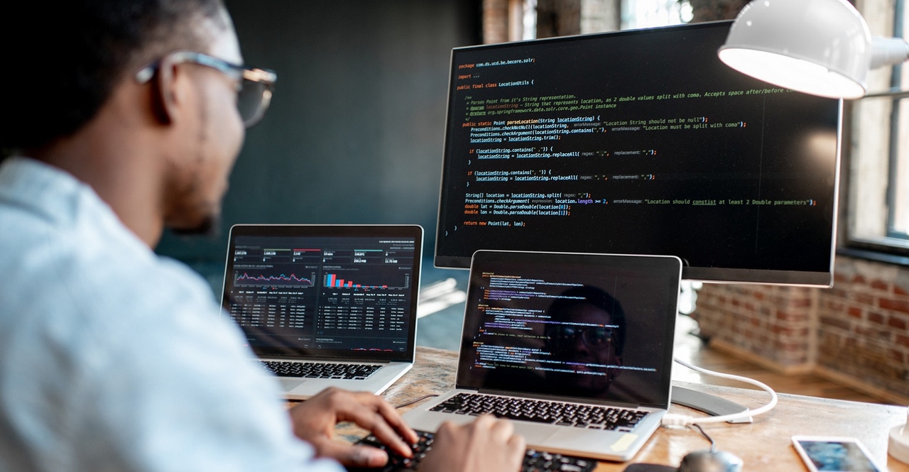 Programmer working with program code Programmer working with program code