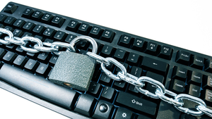 lock and chain around a keyboard lock and chain around a keyboard