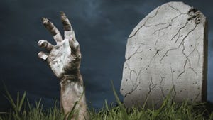 zombie hand coming out of a grave